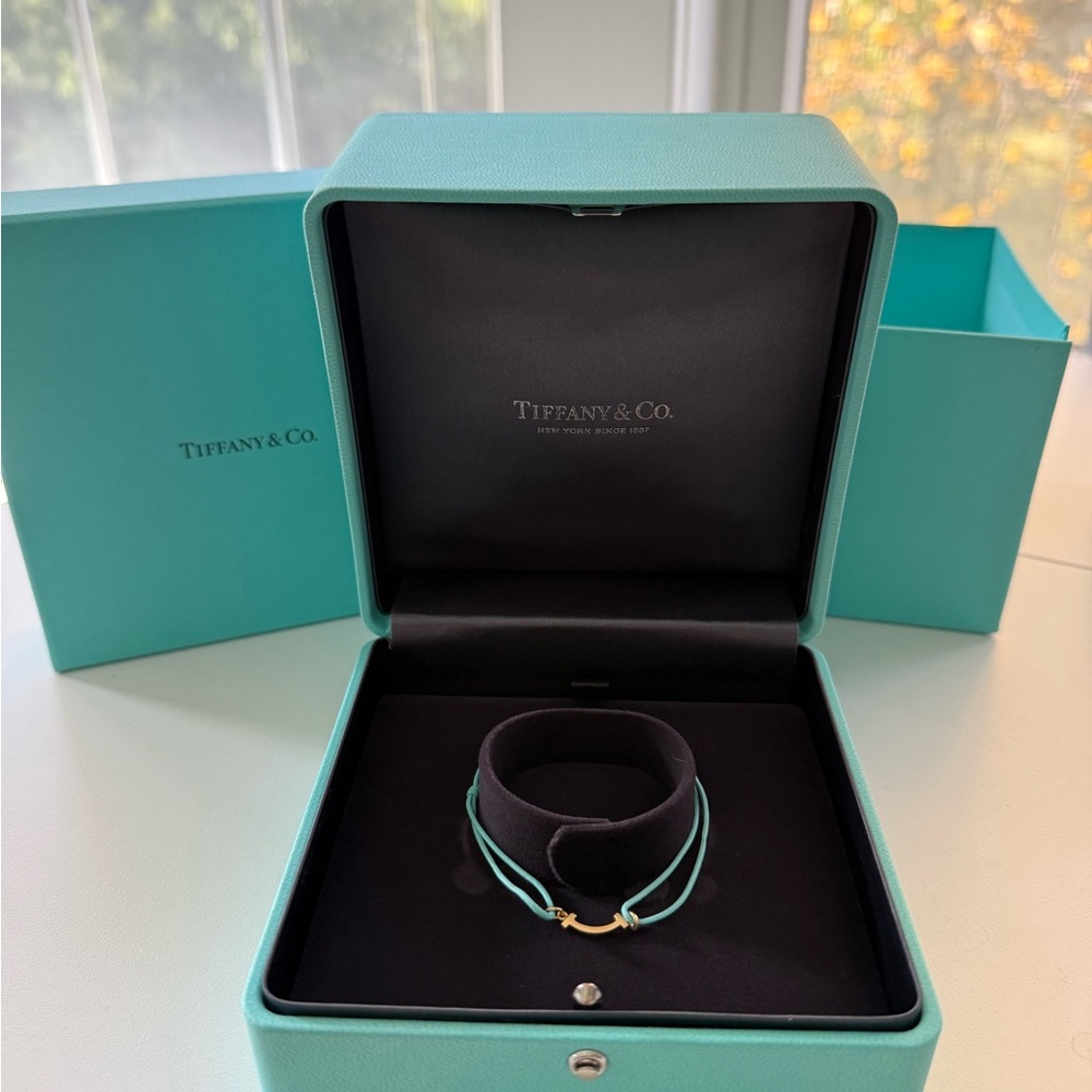 Tiffany & Co. Tiffany T Smile Bracelet in Yellow Gold on a Blue Cord
